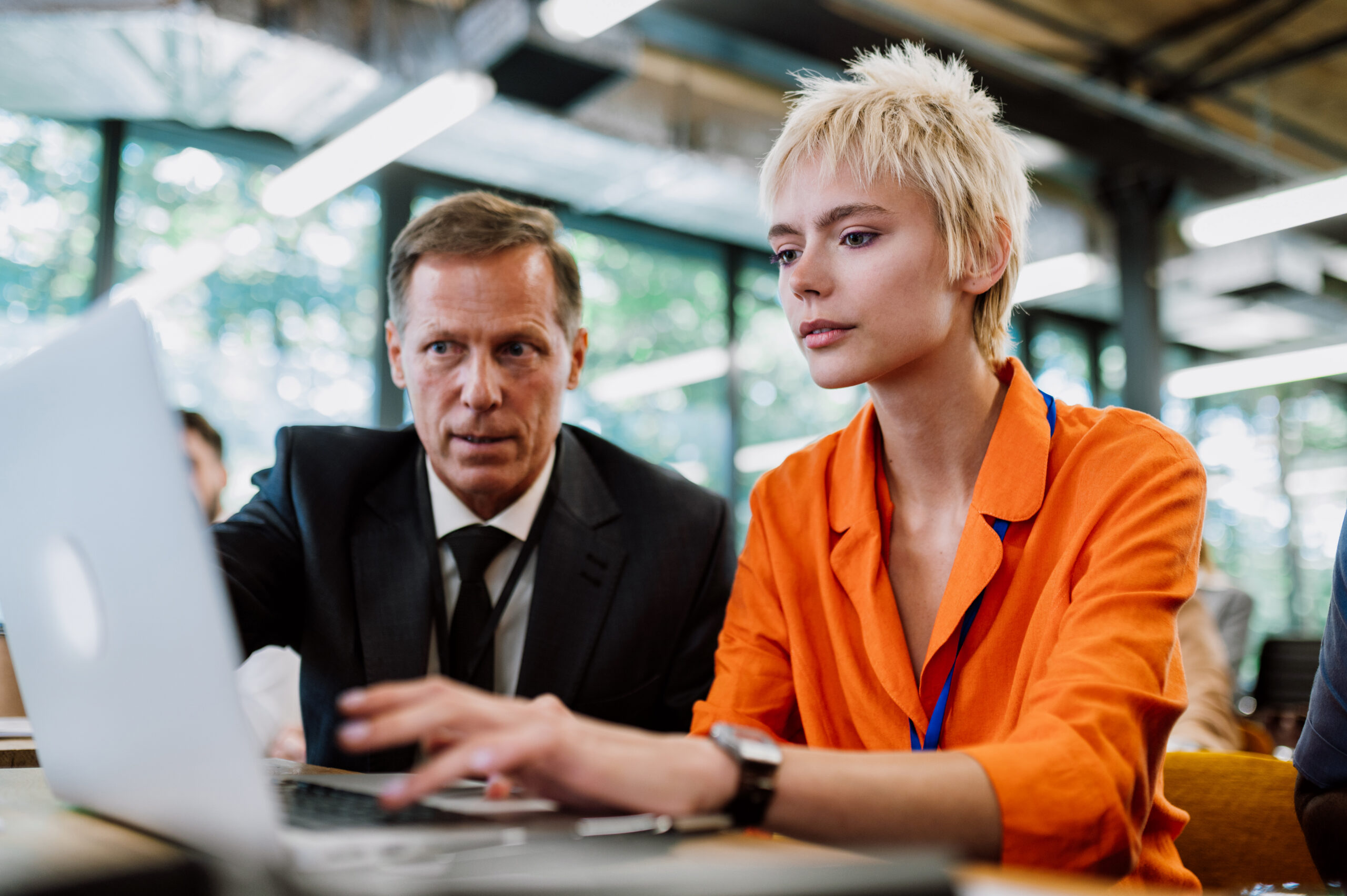 Cinematic image of a conference meeting. Business people sitting in a room listening to the motivator coach. Representation of a Self growth and improvement special event